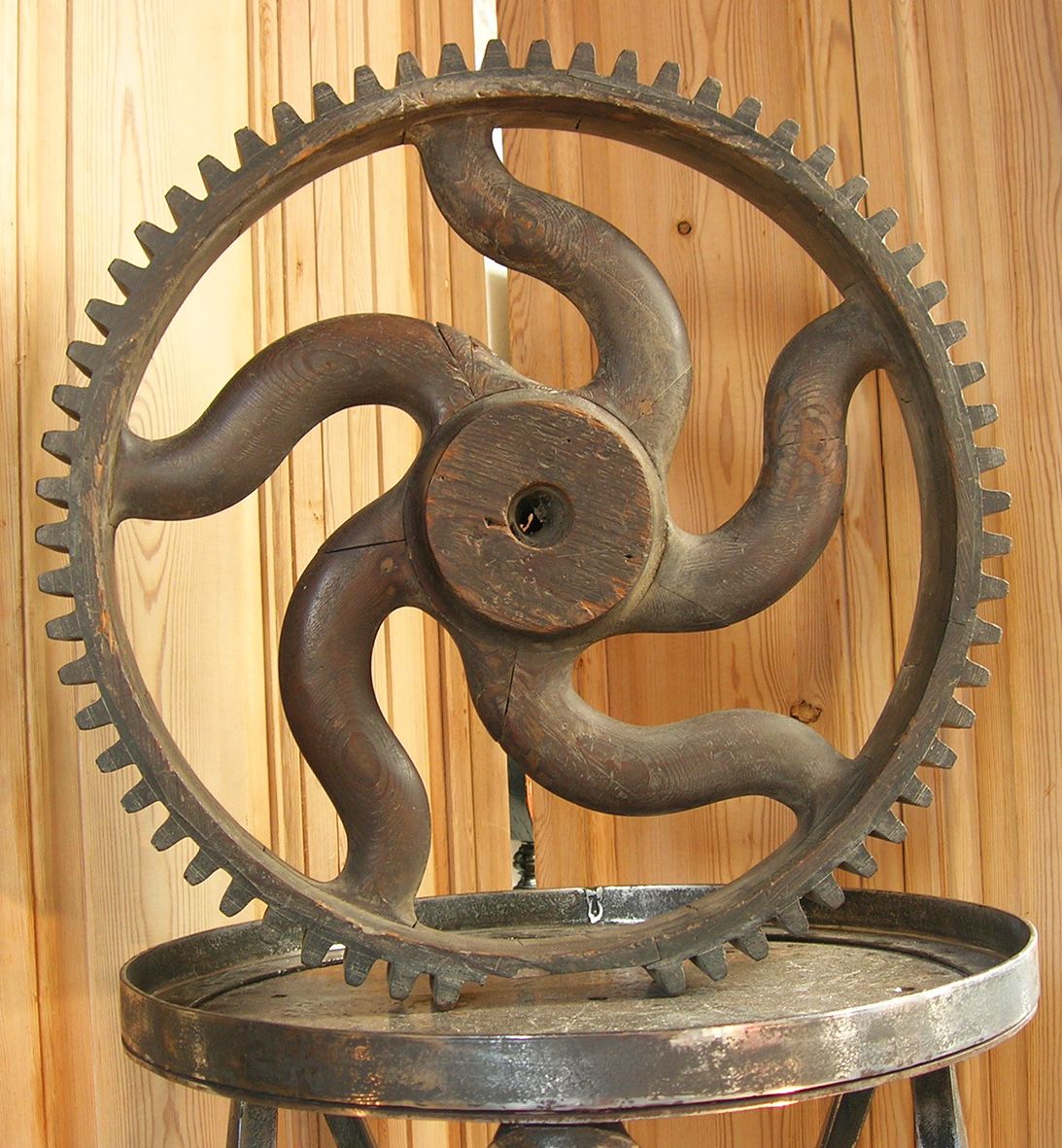 a wooden pattern for casting a gear with curved spokes.jpg